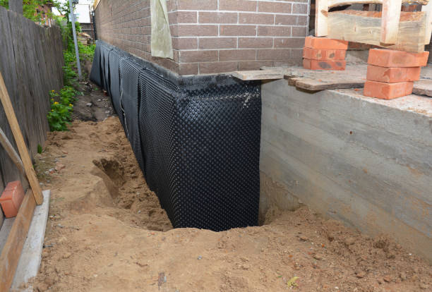 SJ Waterproofing Pros technician performing targeted Vapor Barrier Installation assessment in Rolling Prairie, IN